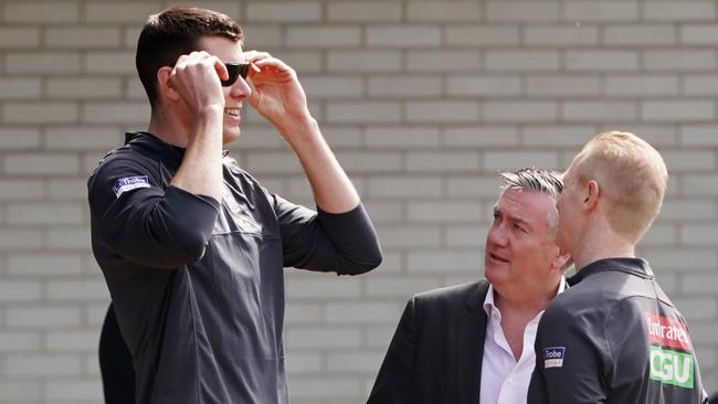 Mason Cox of the Magpies is seen for the first time since his eye operation as he tries on glasses given to him by President Eddie McGuire during a Collingwood training session at the Holden Centre in Melbourne, Wednesday, September 4, 2019. Picture: Michael Dodge