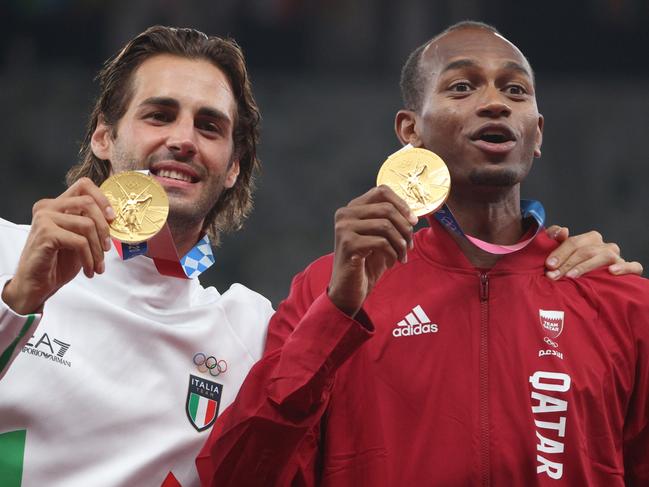 Joint gold medalists Gianmarco Tamberi and Mutaz Essa Barshim shared one of the most heartwarming moments of the Games. Picture: Getty Images