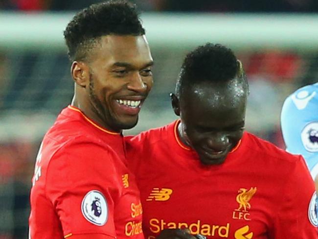 LIVERPOOL, ENGLAND - DECEMBER 27: Ryan Shawcross of Stoke City (R) looks dejected as Daniel Sturridge of Liverpool (L) celebrates with team mates Sadio Mane as he scores their fourth goal during the Premier League match between Liverpool and Stoke City at Anfield on December 27, 2016 in Liverpool, England. (Photo by Alex Livesey/Getty Images)