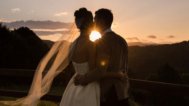 Good trim: Brendan Scheiwe and Kelly Gaffney enjoy an intimate moment as the sun sets, photography: Quince and Mulberry Studios