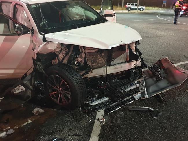 The aftermath of a smash where a driver sped up to beat a yellow light.