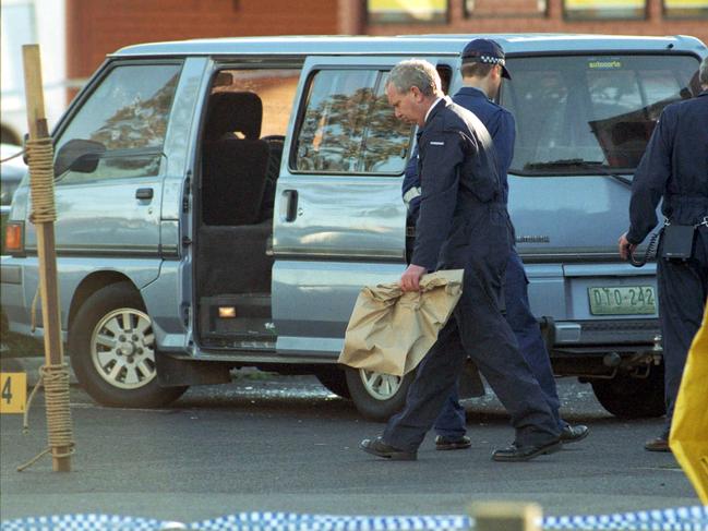 Police collect evidence from the Cross Keys Reserve crime scene.