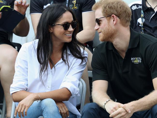Meghan wore ‘The Husband Shirt’ for her first public appearance with Prince Harry at the Invictus Games in Toronto last year. Picture: Getty Images
