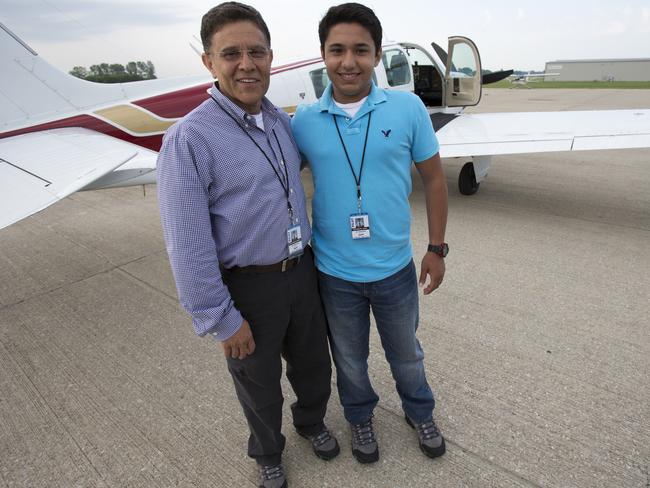 Babar Suleman and son Haris Suleman, 17, stand next to their plane at an airport in Greenwood, Indiana. AP Photo/The Indianapolis Star, Robert Scheer