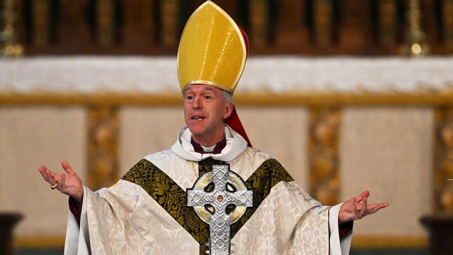 Archbishop of Wales, Andrew John, takes part in a ceremony to bless The Cross of Wales at Holy Trinity Church in Llandudno, north Wales. Picture: AFP