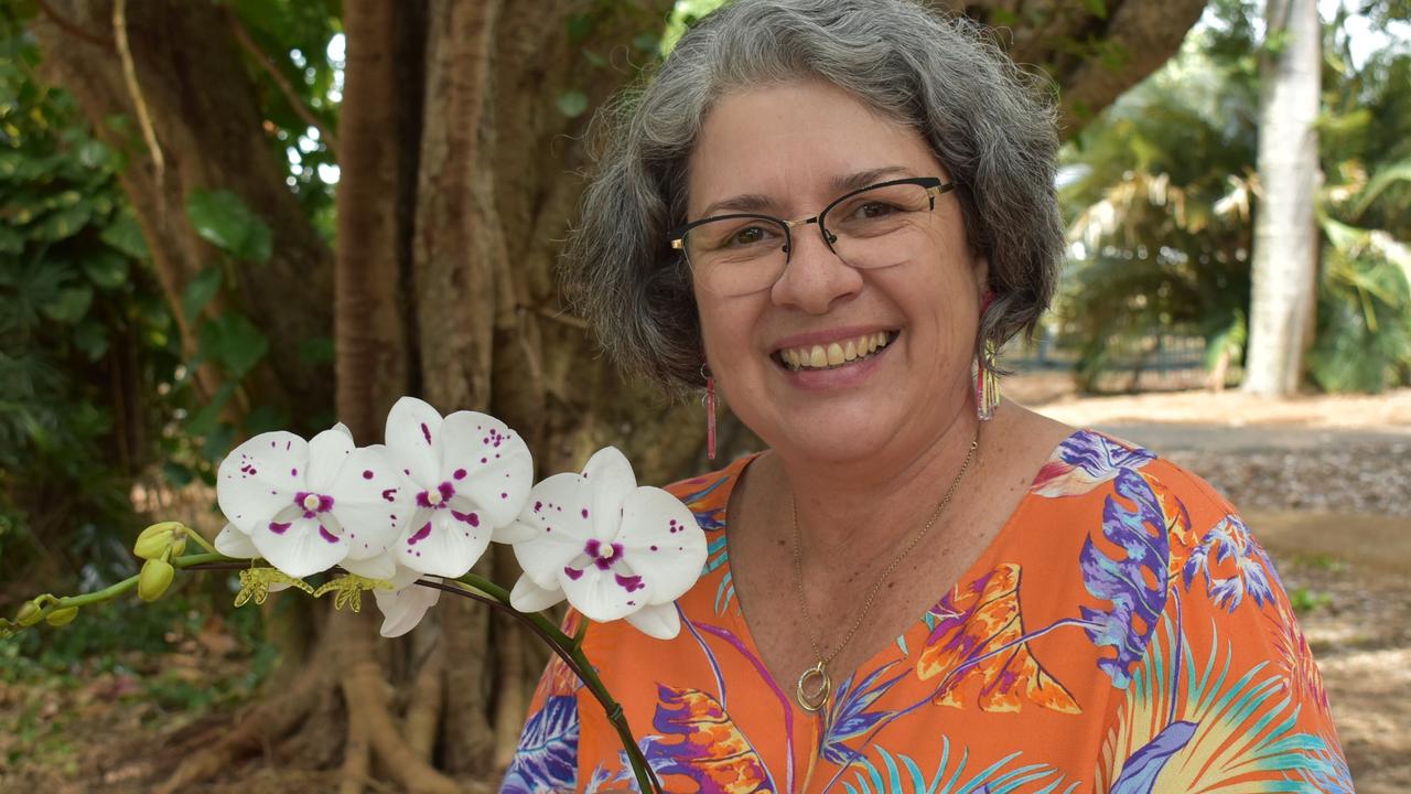 Sarina woman Susan Rawlings holding a stunning phalaenopsis Allura King Jupiter. Photo: Janessa Ekert