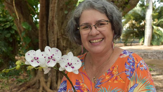 Sarina woman Susan Rawlings holding a stunning phalaenopsis Allura King Jupiter. Photo: Janessa Ekert