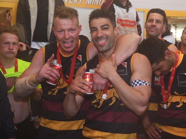 Doncaster East players celebrate in the clubrooms after being victorious in the EFL Div 2 Grand Final.