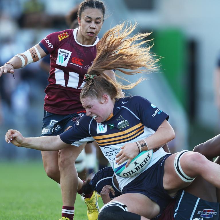 Grace Kemp is brought down in a game against Queensland Reds.
