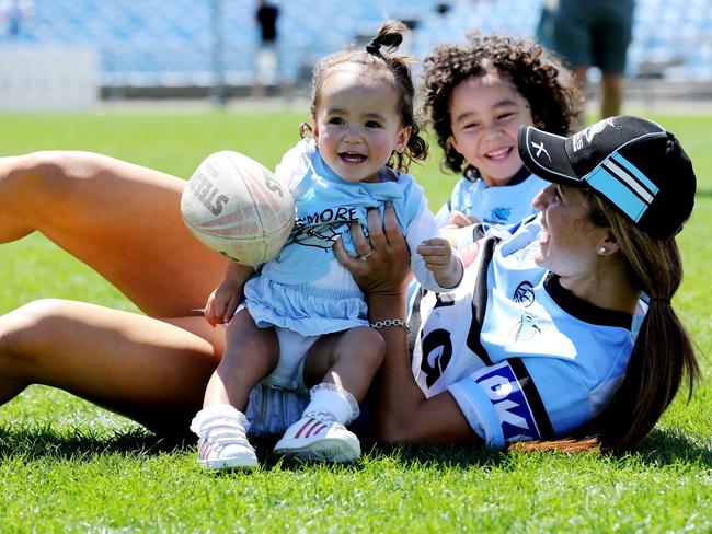 Siobhan Quince enjoys a moment on the hallowed turf with Ryder,4 and River, 18 months. Picture: Stephen Cooper