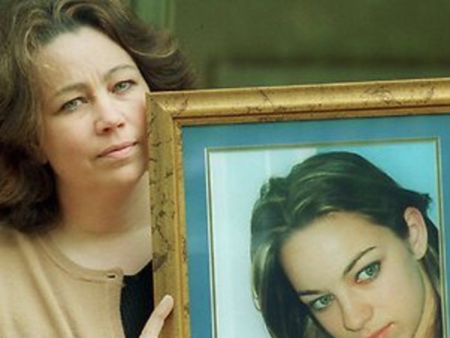 Elizabeth Barber holds a photo of Rachel.