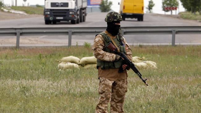 A Ukrainian soldier secures an area outside the southern city of Odessa on May 9, 2014.