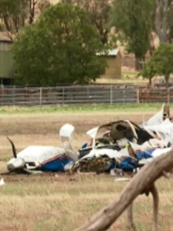 The crumpled wreck of one of the aircraft sits in a paddock near the Mangalore airport. Picture: Nine News