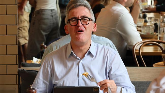 Woolworths chief executive Brad Banducci tucks into a steak sandwich and chips at a Surry Hills cafe on Wednesday after his retirement announcement. Picture: Michael Bilbe-Taylor