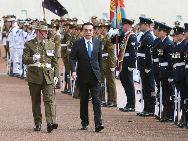 Premier of the State Council of the People’s Republic of China Li Keqiang and his wife Madame Cheng Hong at a ceremonial welcome at Parliament House in Canberra. Picture: Kym Smith