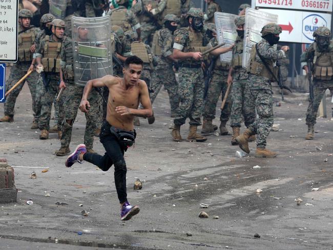 Protesters clash with Lebanese security forces outside the US Embassy in Awkar east of Beirut. Picture: AFP