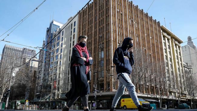 People abiding by the rules of mandatory mask wearing throughout Melbourne due to a second wave of coronavirus. Picture: NCA NewsWire / Ian Currie