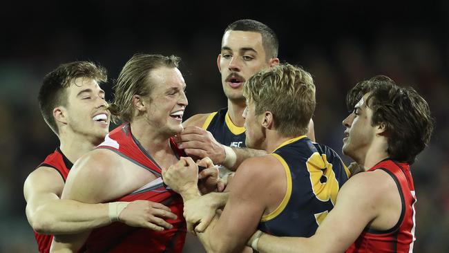 AFL – Round 18 – Adelaide Crows v Essendon at Adelaide Oval. Tempers Flare between Mason Redman and Rory Sloane – while Zach Merrett, Taylor Walker and Andrew McGrath try to pull them apart Picture SARAH REED