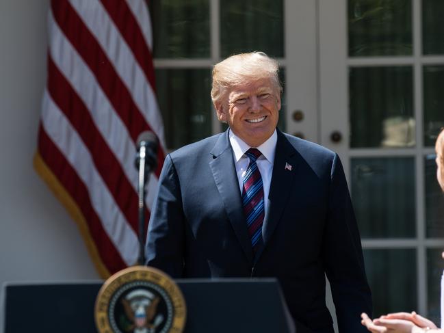 US President Donald Trump arrives to speak about tax cuts for Americans from the Rose Garden at the White House on April 12, 2018 in Washington, DC. / AFP PHOTO / NICHOLAS KAMM