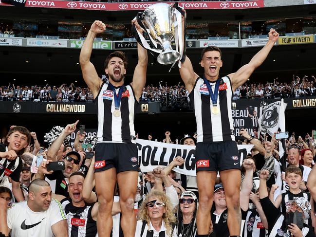 MELBOURNE , AUSTRALIA. September 30, 2023. AFL Grand Final between Collingwood and the Brisbane Lions at the MCG.  Josh Daicos and Nick Daicos of the Magpies with the cup celebrating   .Picture by Michael Klein