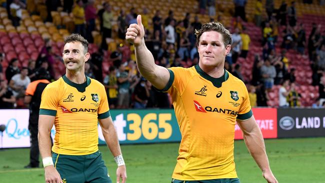 BRISBANE, AUSTRALIA - NOVEMBER 07: Michael Hooper and Nic White of the Wallabies wave to the fans as they celebrate victory after the 2020 Tri-Nations match between the Australian Wallabies and the New Zealand All Blacks at Suncorp Stadium on November 07, 2020 in Brisbane, Australia. (Photo by Bradley Kanaris/Getty Images)