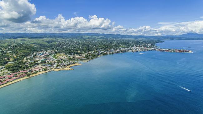 EMBARGO FOR TWAM, 26 OCTOBER 2024. FEE MAY APPLY. An aerial view of ships and boats anchored at the harbour in Honiara.