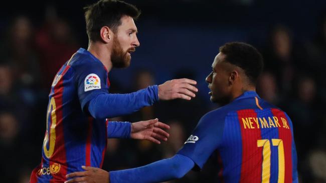 Barcelona's Argentinian forward Lionel Messi (L) celebrates with Neymar.