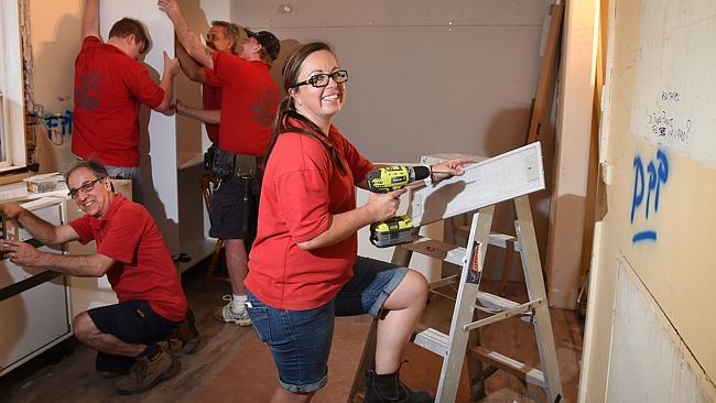 Bunnings team at house installing new kitchen for house with homeless kids