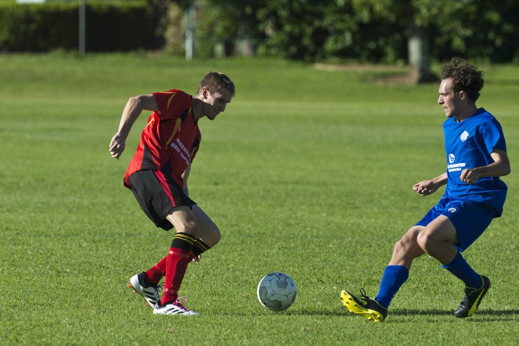 Brendan Newby (left) of Gatton and Rockville player Braiden Hinch in Toowoomba Football League Premier Men round six at Captain Cook ovals, Sunday, April 7, 2019. Picture: Kevin Farmer