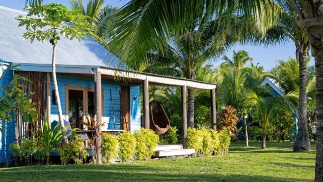 The accommodation is simple, but perfect for wannabe castaways. Thirteen brilliant-blue cottages shaded by palms. Picture: Oarsman's Bay Lodge.