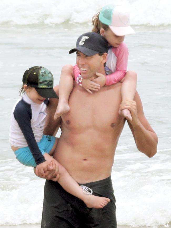 Grant Hackett on the beach at Miami with his kids Charlize and Jagger.