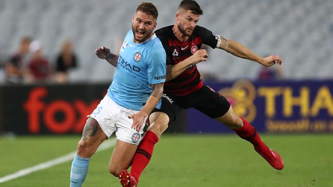 Brendan Hamill of the Wanderers fouls Bart Schenkeveld of Melbourne City during Tuesday night’s match. Picture: Getty Images