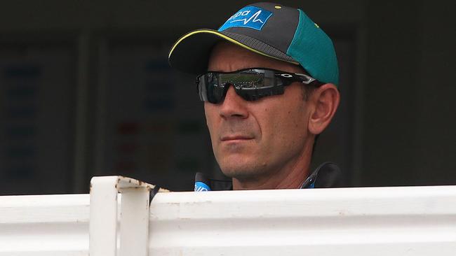 Australian head coach Justin Langer watches from the pavillion. Picture: AFP