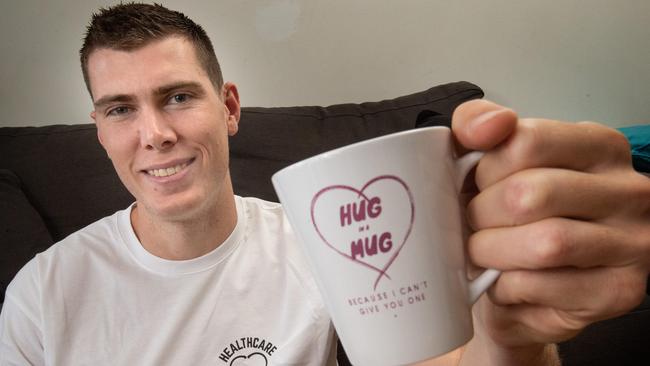 Collingwood player Mason Cox is supporting a new campaign called Hugs and Heroes. Picture: Tony Gough