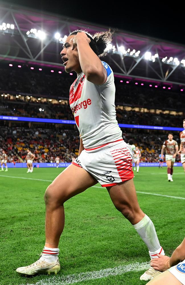 BRISBANE, AUSTRALIA - JULY 13: Christian Tuipulotu of the Dragons celebrates scoring a try during the round 19 NRL match between Brisbane Broncos and St George Illawarra Dragons at Suncorp Stadium, on July 13, 2024, in Brisbane, Australia. (Photo by Albert Perez/Getty Images)