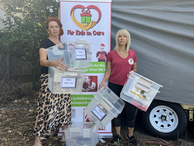 Melanie Bosenberg and Jane Padden from charity For Kids in Care with empty boxes after thieves stole items intended from children from their trailer in Oxenford. Picture: Keith Woods.