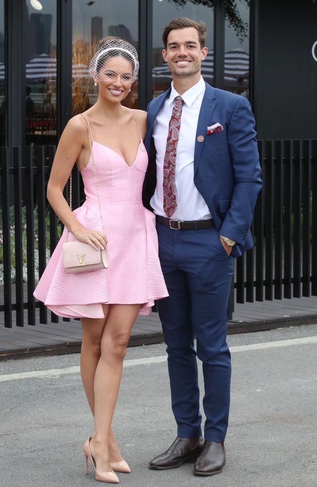 Demi Brereton and North Melbourne AFL captain Jy Simpkin at Stakes Day in Melbourne. Picture: NCA NewsWire / David Crosling