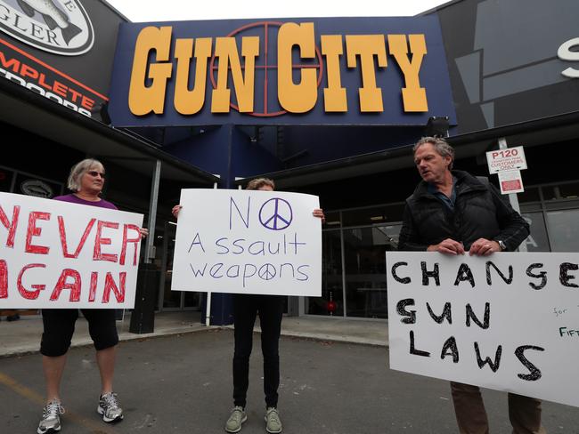 Protesters at the front of the largest gun shop in Christchurch calling for change to current gun laws. Picture: Gary Ramage