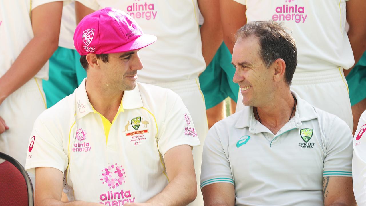Australian captain Pat Cummins talks to former head coach Justin Langer. Picture: Mark Metcalfe