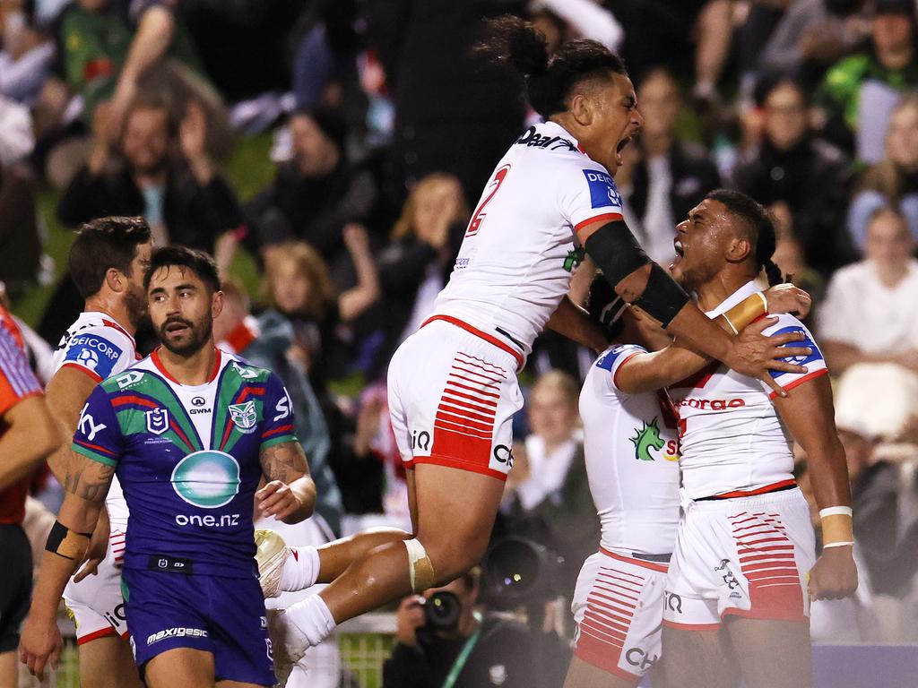 Moses Suli of the Dragons celebrates with teammates after scoring a try. Photo: Mark Kolbe/Getty Images