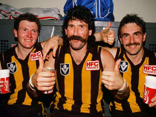 Gary Buckenara, Robert Dipierdomenico and John Kennedy of the Hawks celebrate in the rooms after winning the 1989 VFL Grand Final between the Hawthorn Hawks and the Geelong Cats at the Melbourne Cricket Ground.