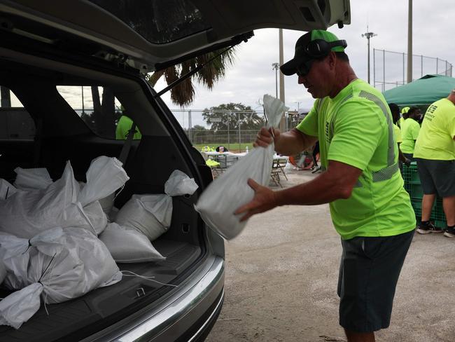 Sandbags are filled and placed into cars in St. Petersburg, Florida, as the state prepares for the arrival of Hurricane Milton. Picture: Spencer Platt/Getty Images