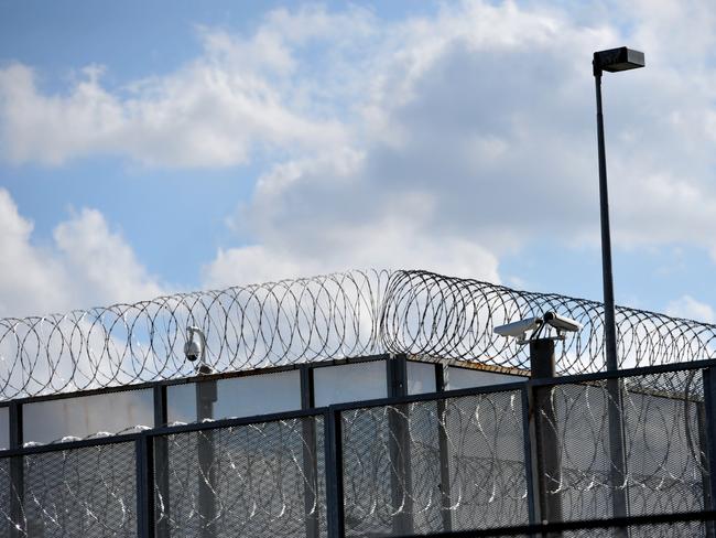 The perimeter fence at Silverwater jail in Sydney's west, Monday, April 1, 2013. Two prisoners have been found dead in a cell at Silverwater jail during an inspection early today. (AAP Image/Paul Miller) NO ARCHIVING