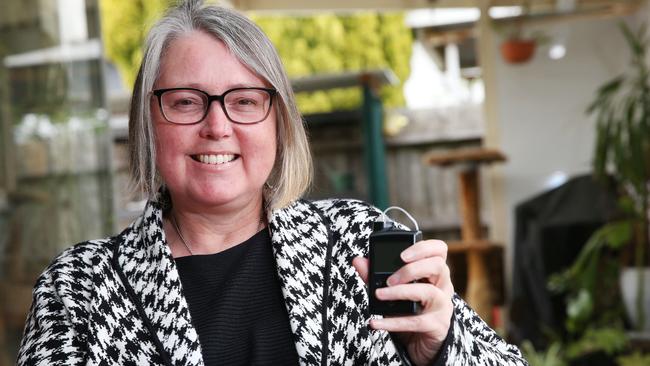 Linda Hobbs lives with type 1 diabetes. Linda is holding a device that automatically administers the insulin she needs. Picture: Alan Barber