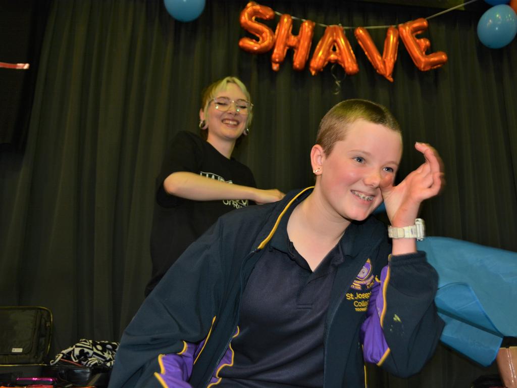 At the St Joseph's College 2023 World's Greatest Shave event is Meghan Ellis getting her cut by hairdresser Caitlin Symes from the Hair Room on Russell. Picture: Rhylea Millar