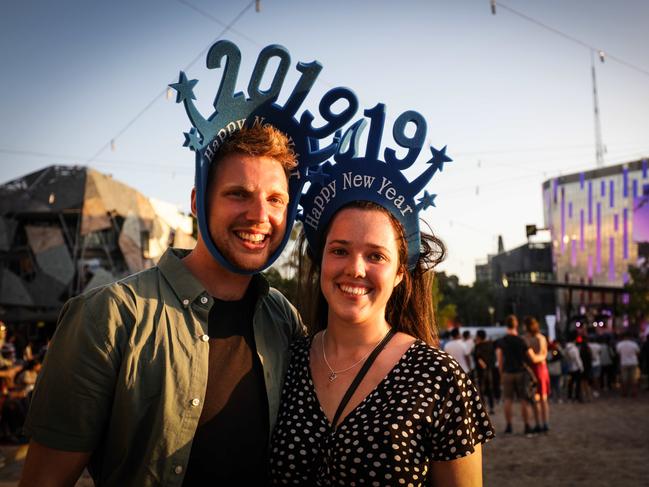 Mount Eliza couple Chloe Harper and Jack Franks celebrate 2019 at Federation Square. Picture: Nicole Cleary