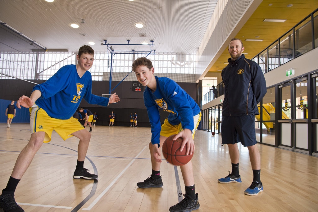 Basketball captain Jason Spurgin (left) and Samuel Harmsworth with TGS director of basketball Kabe Cirolini in the new Toowoomba Grammar School gymnasium, Tuesday, July 24, 2018. Picture: Kevin Farmer