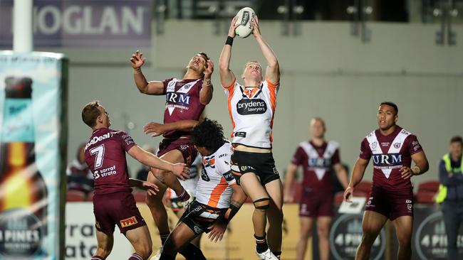 Adam Doueihi scores the game winning try to seal the Tigers’ victory. Picture: Getty Images.