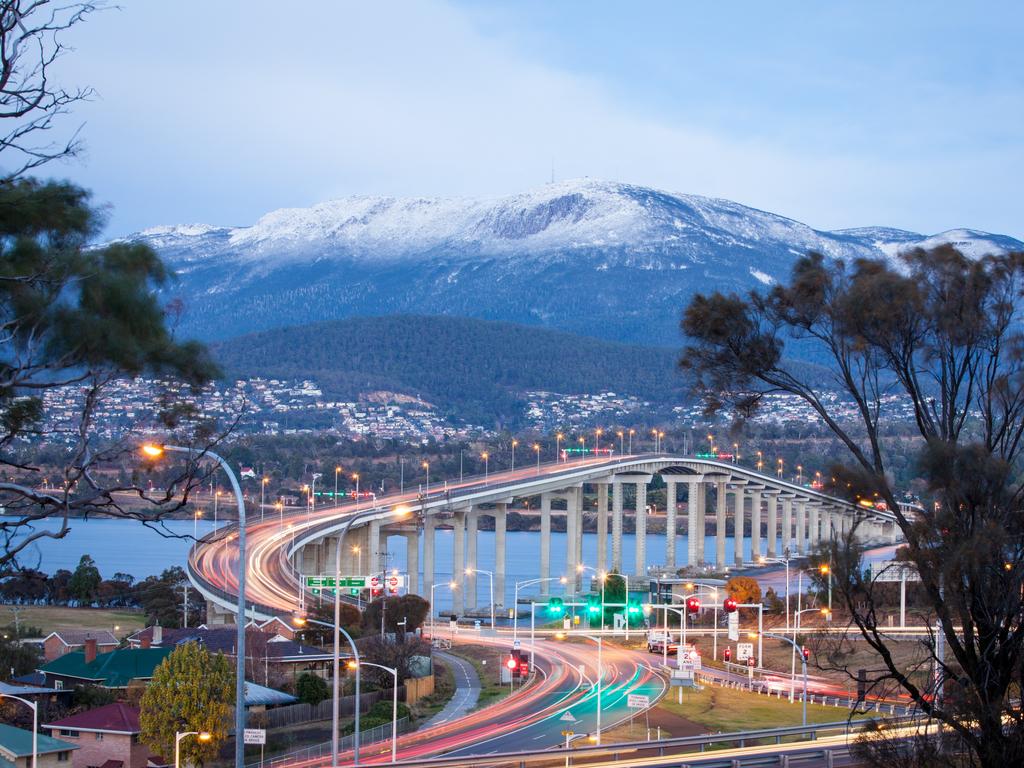 Mt Wellington / kunanyi with snow and the Tasman Bridge in the foreground. Picture: Hyun Jeon