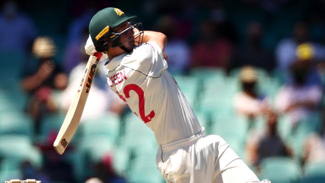 Cameron Green lofts one of four sixes into the stands at the SCG on Sunday